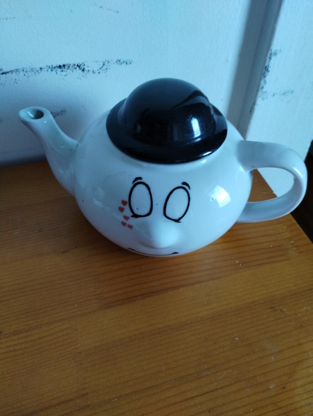 Novelty White Ceramic Teapot with Black Lid and Face Design